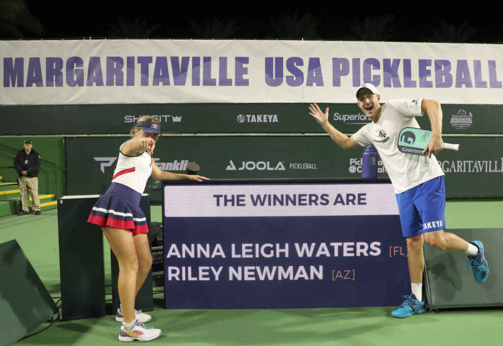 INDIAN WELLS, CA - NOVEMBER 13: Riley Newman hits a backhand shot against Ben Johns and Catherine Parenteau in the Pro Mixed Doubles championship match of the 2022 Margaritaville USA Pickleball Nationals Championships at Indian Wells Tennis Garden on November 13, 2022 in Indian Wells, California. (Photo by Bruce Yeung/Getty Images)