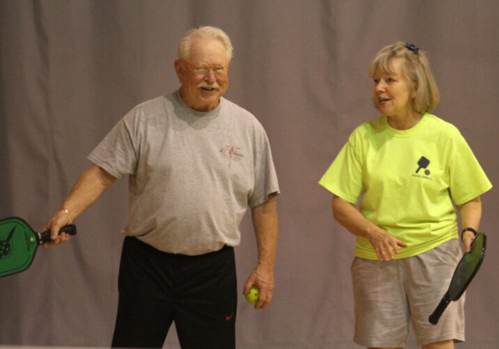 AMY SWEENEY/Staff photo. Jim Rogers and Linda Collins chat during a break in their Pickle Ball game on Wednesday at the Plaistow YMCA.